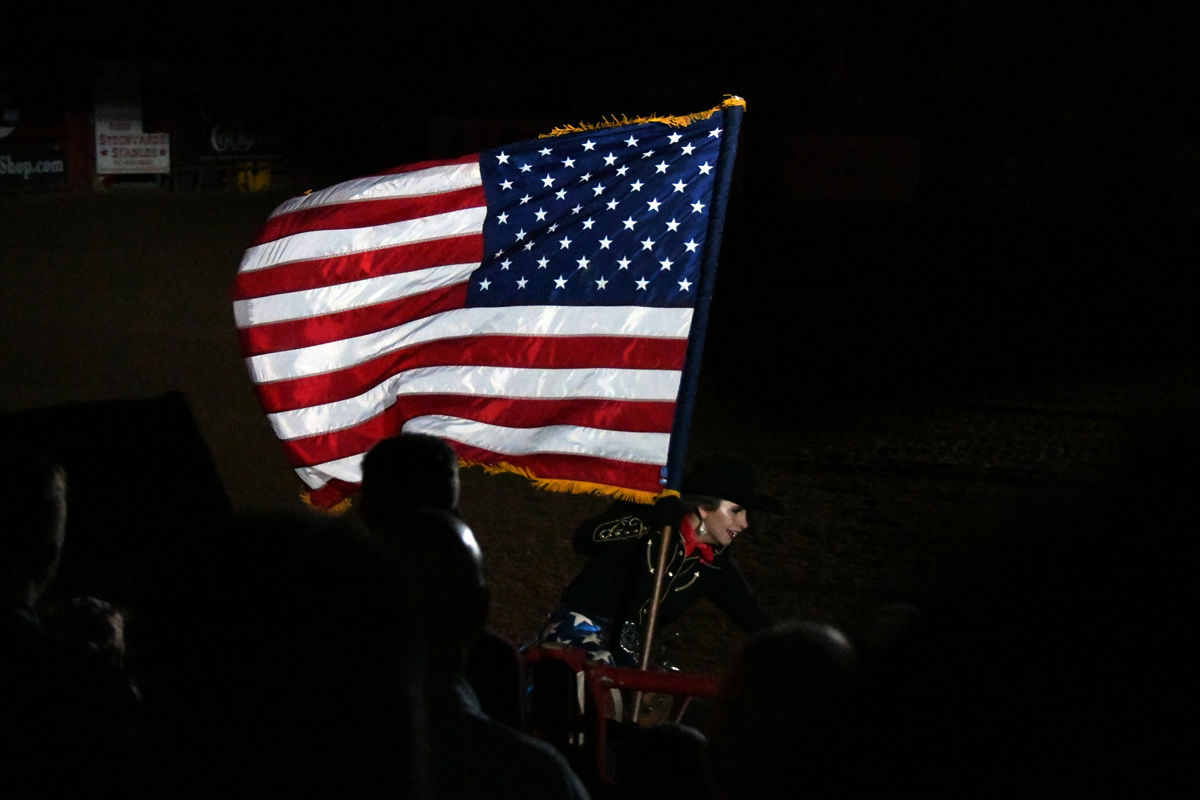 058 The rodeo begins with a patriotic salute.JPG